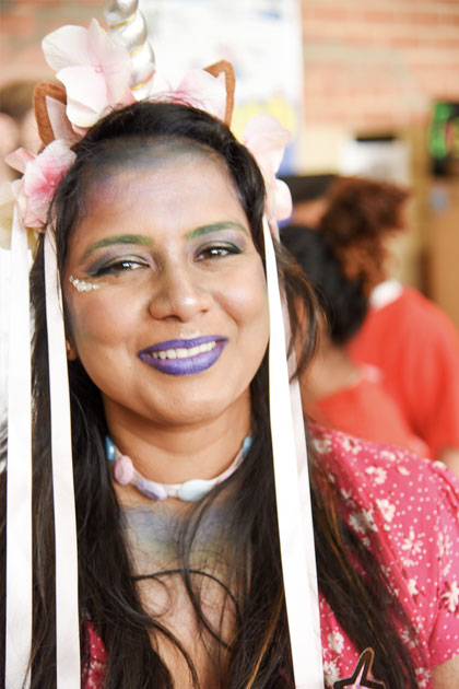 Female students with long white ribbons in her hair and purple lipstick